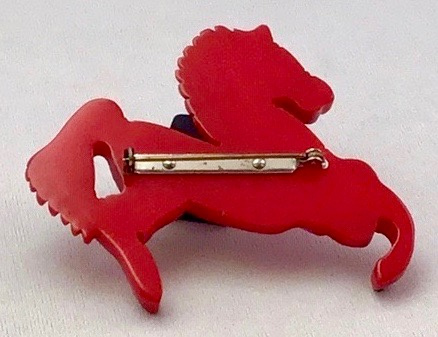 BP52 red bakelite carousel horse pin